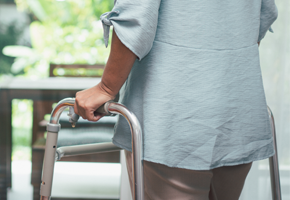 Woman using walker to move